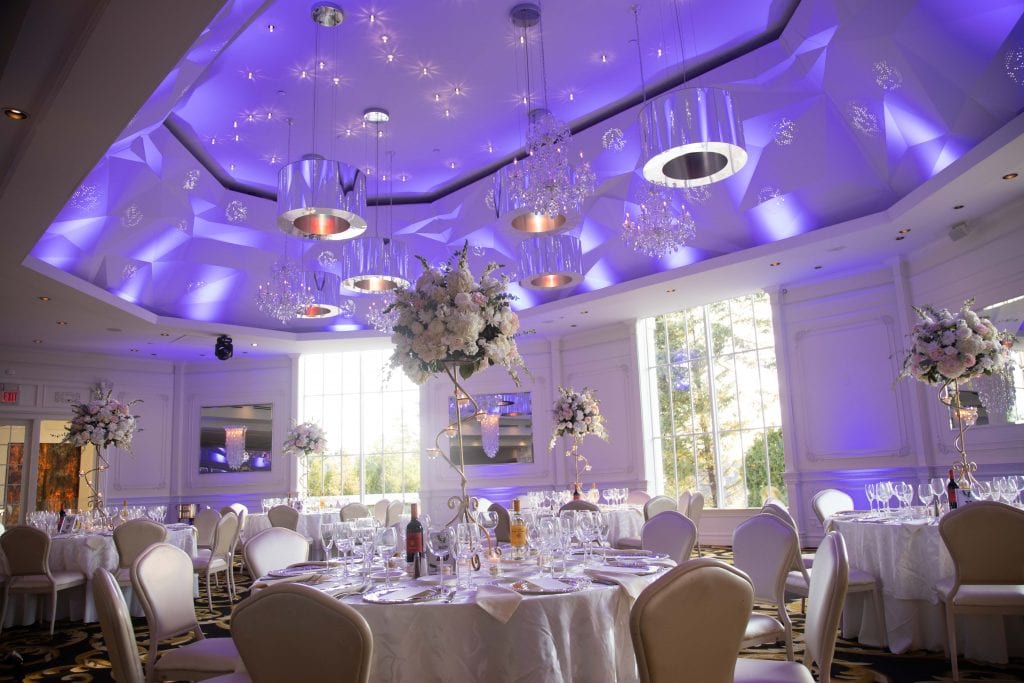 New-jersey-wedding-venue-with-table-setting-and-event-wedding-space-bathed-in-purple-light