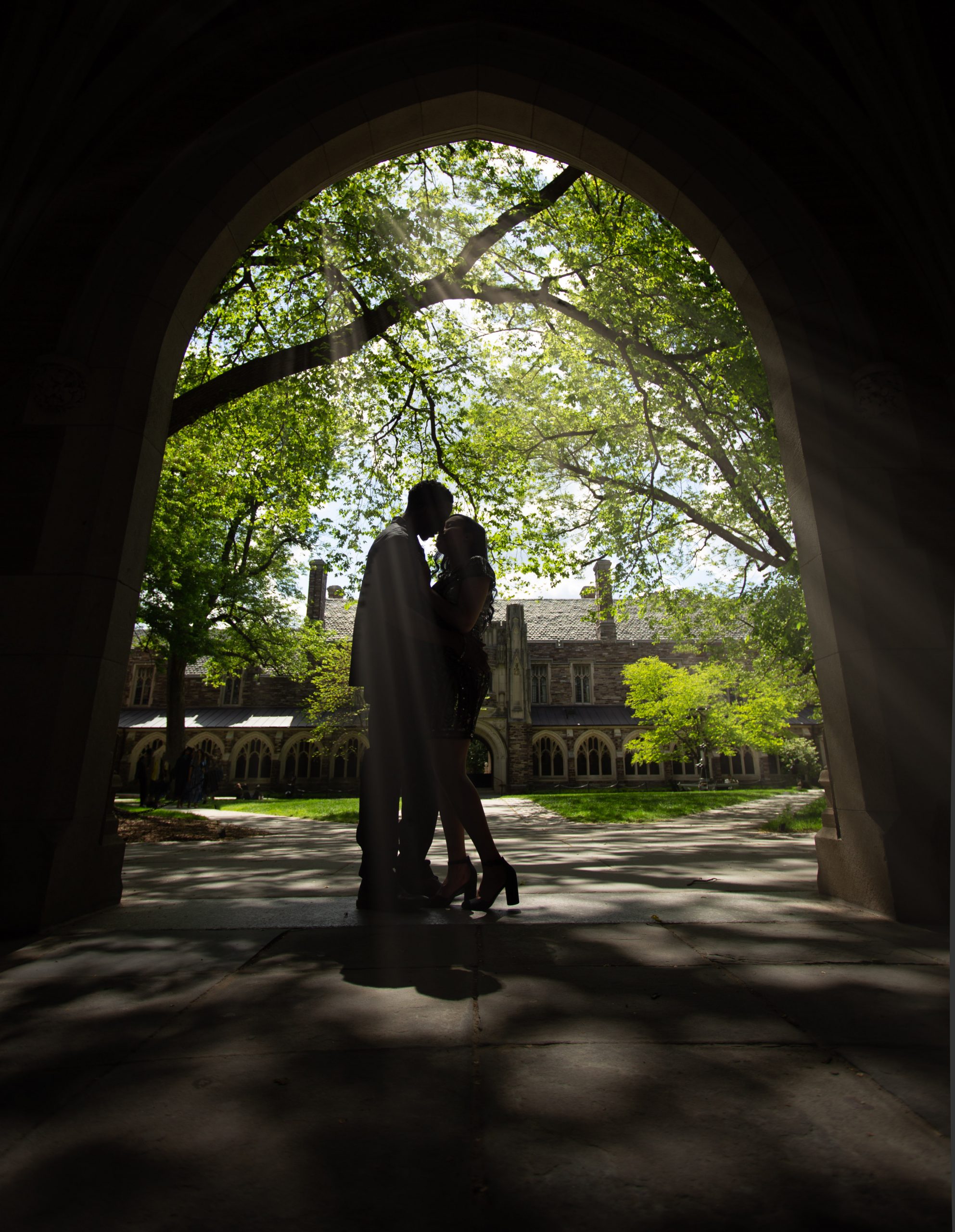 engage-couple-standing-in-the-archway-at-Princeton-umiversity
