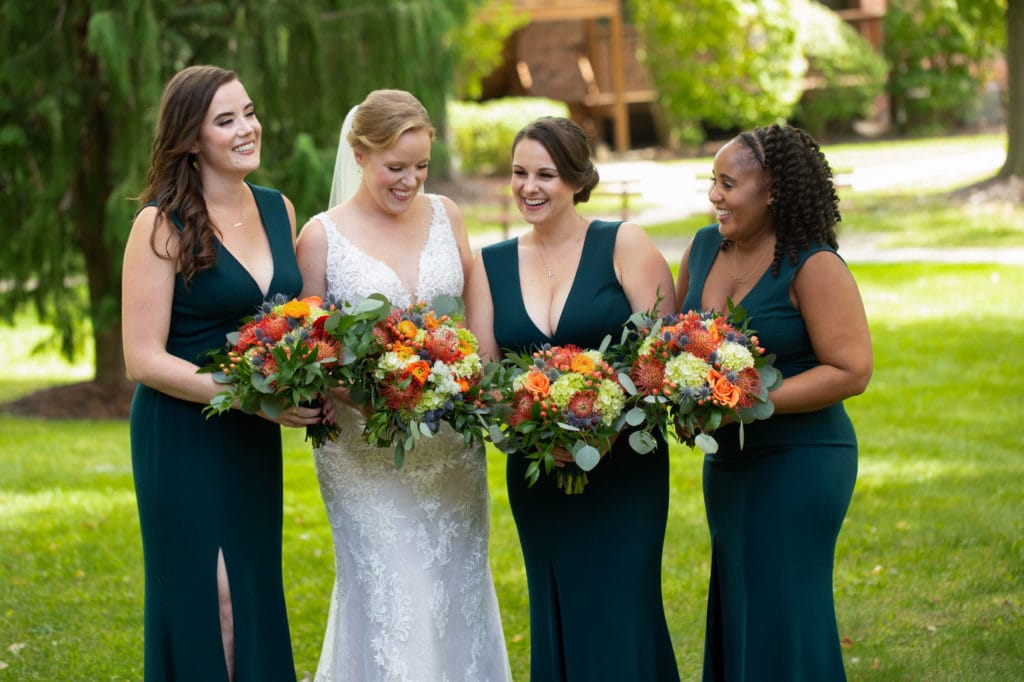 Bridesmaids wearing emerald-green-bridesmaid-dresses