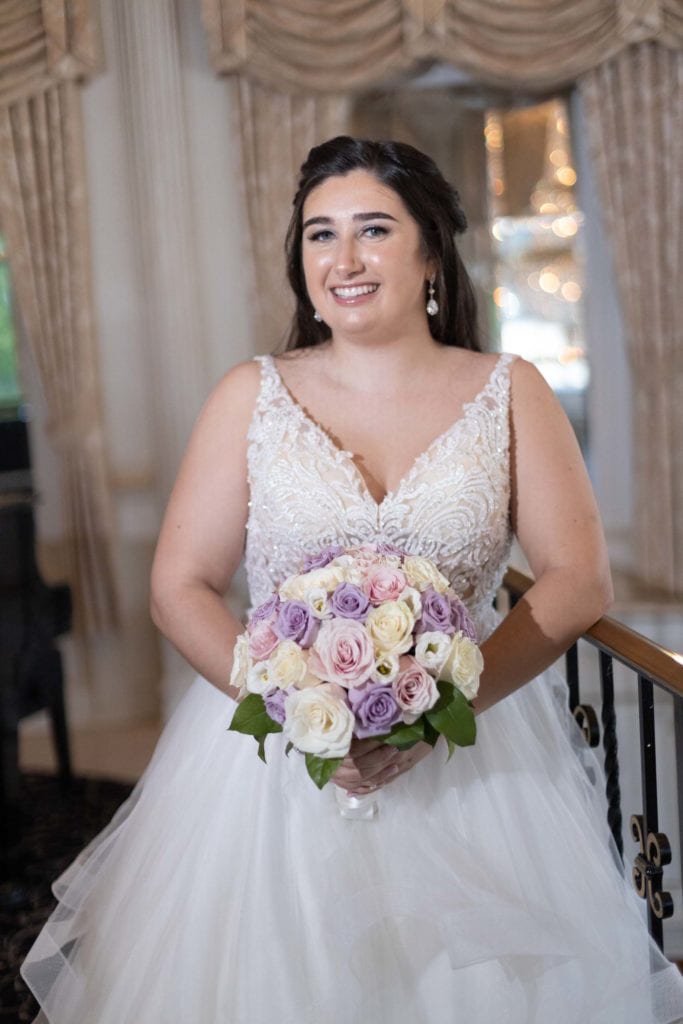 Plus-size White wedding dress and Curvy Bide posing on the balcony at the Tides Estates