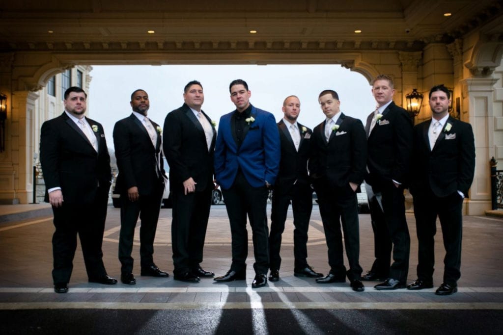 Wedding Venue - banquet style - Groomsmen standing at the entrance of the legacy castle