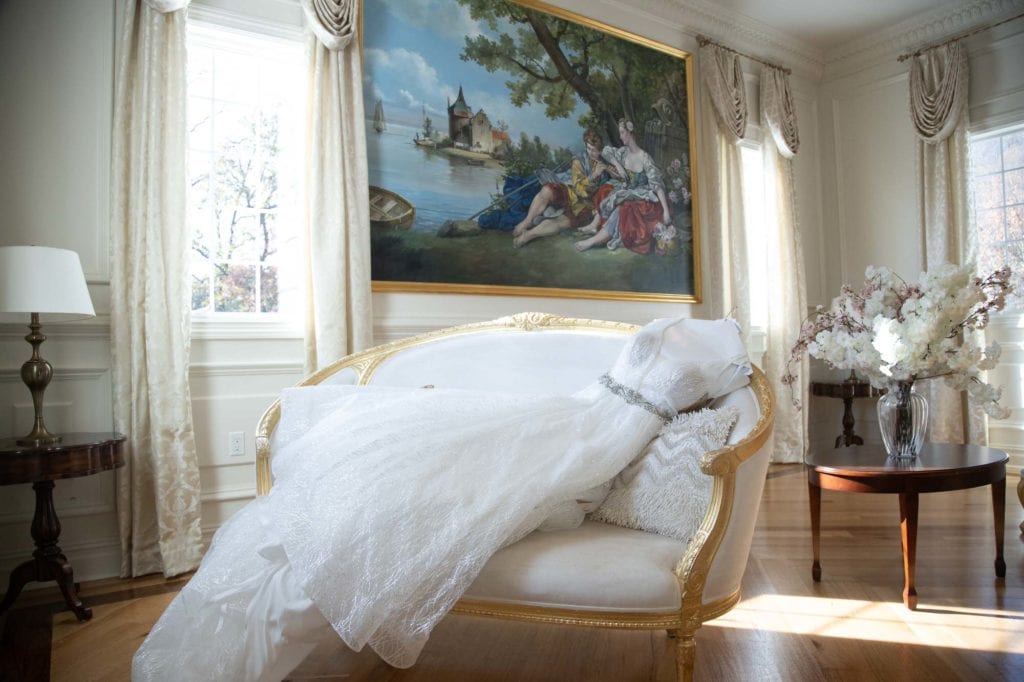 Wedding Venue - Wedding dress draped across french style furniture