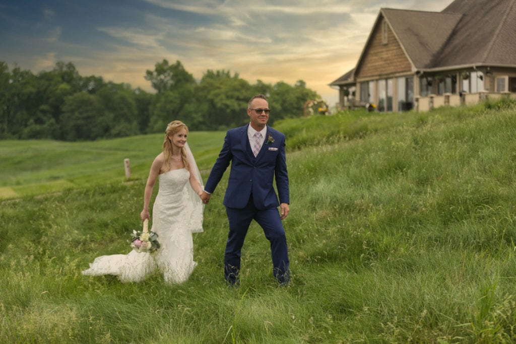 wedding venue - Golf club style- mature-bride-and-groom-walking-together-holding-hands