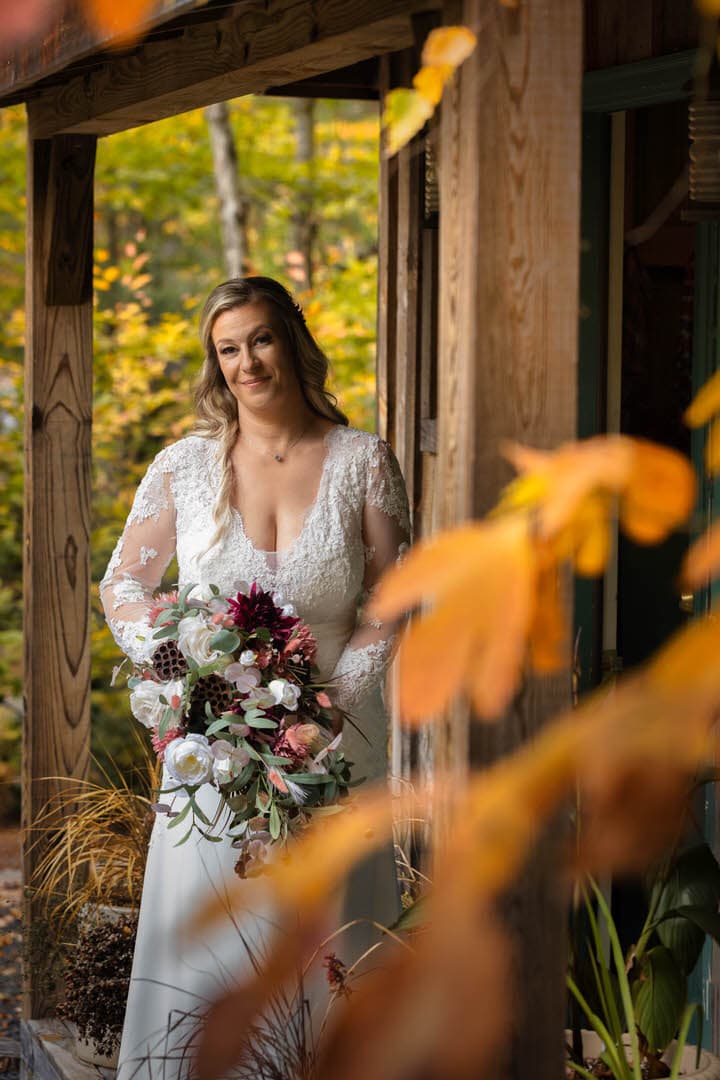 Mature bride standing lodge at Tall Timber Barns in Pennsylvania