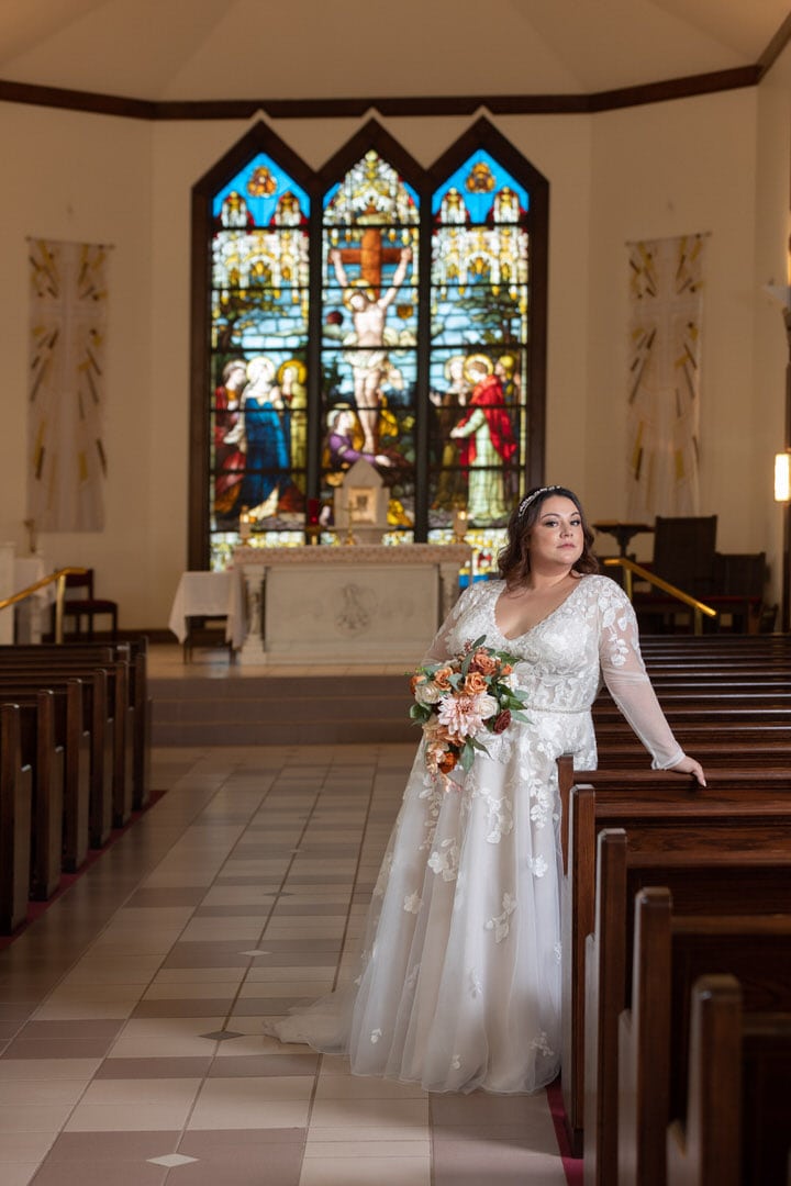 plus-size bride standing in Catholic church